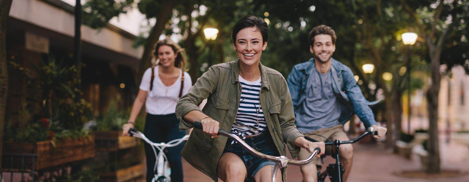 a group of people riding bikes