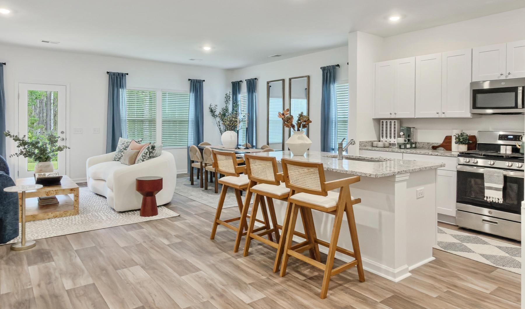 a kitchen with a dining table and chairs