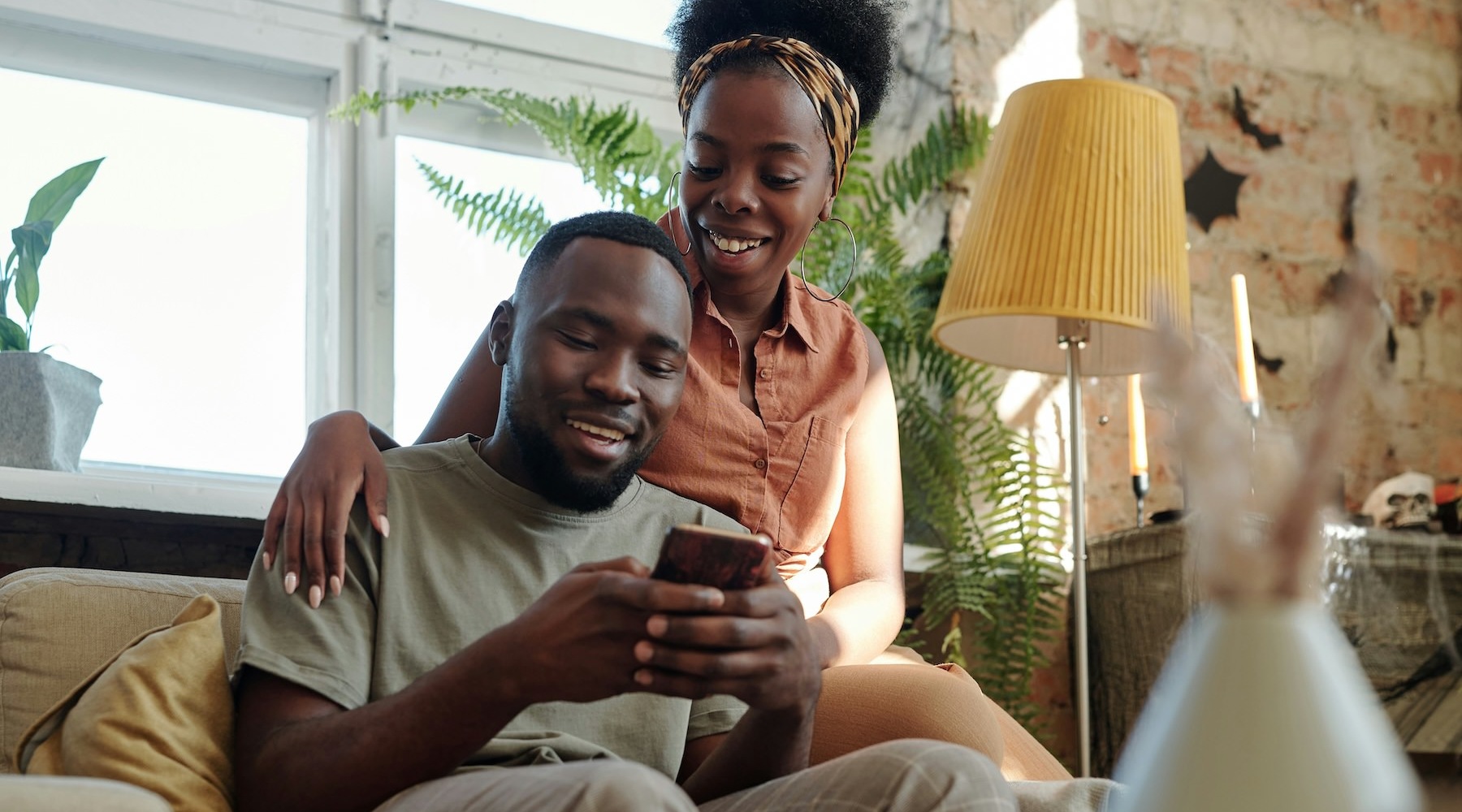a couple looking at a phone