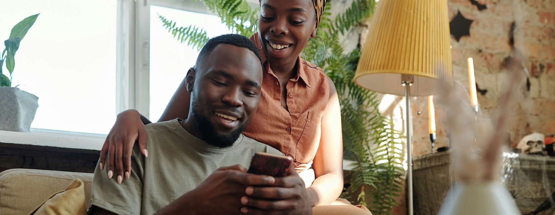 a couple looking at a phone