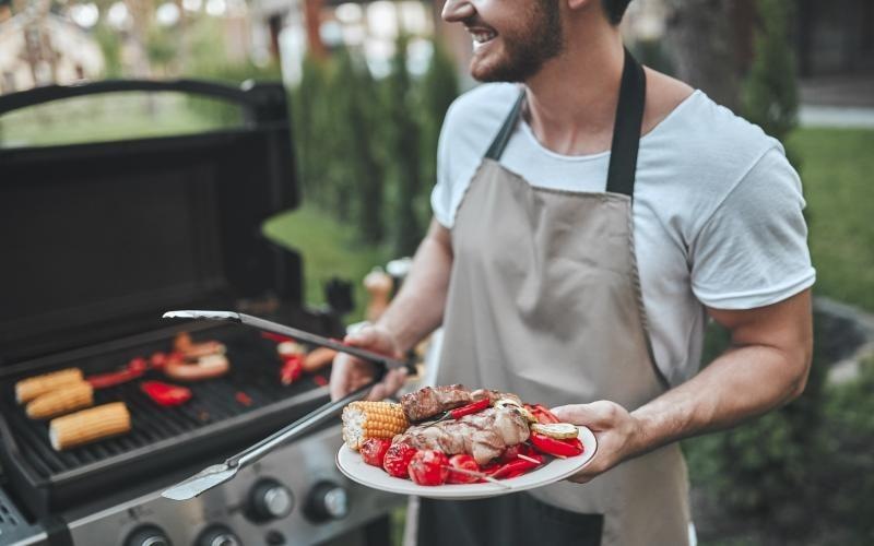 a man holding a plate of food